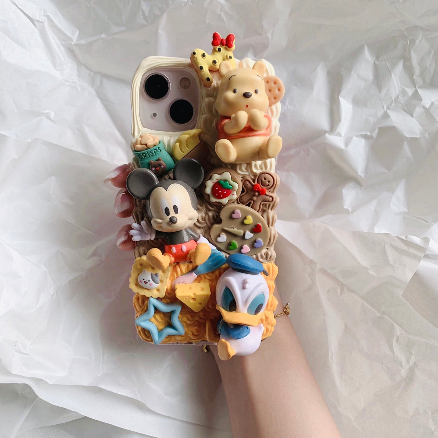 Phone cases with cartoon figures (Mick*y mouse)