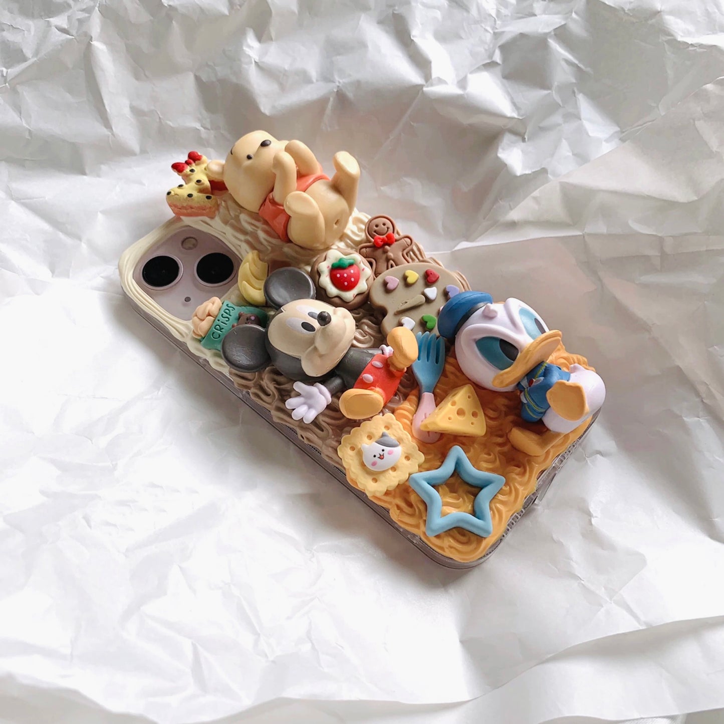 Phone cases with cartoon figures (Mick*y mouse)