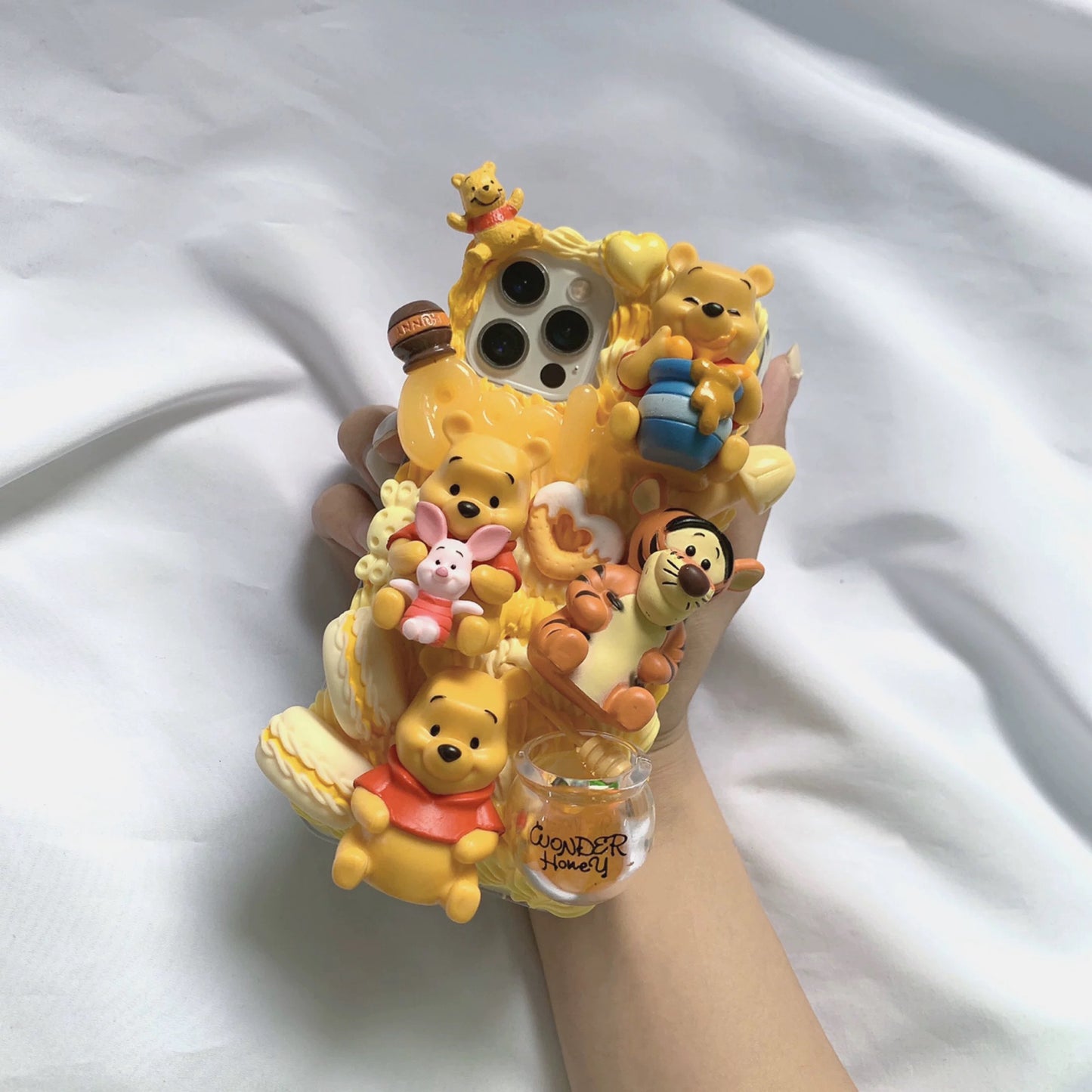 Phone case with cartoon figures ( Winnie the Pooh)